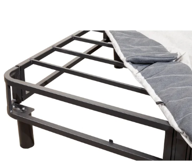 Metal bed frame with mattress on a white background